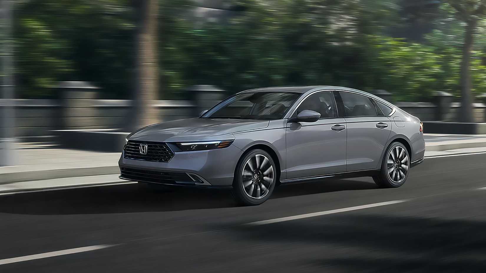 A Gray 2024 Honda Accord Hybrid Driving