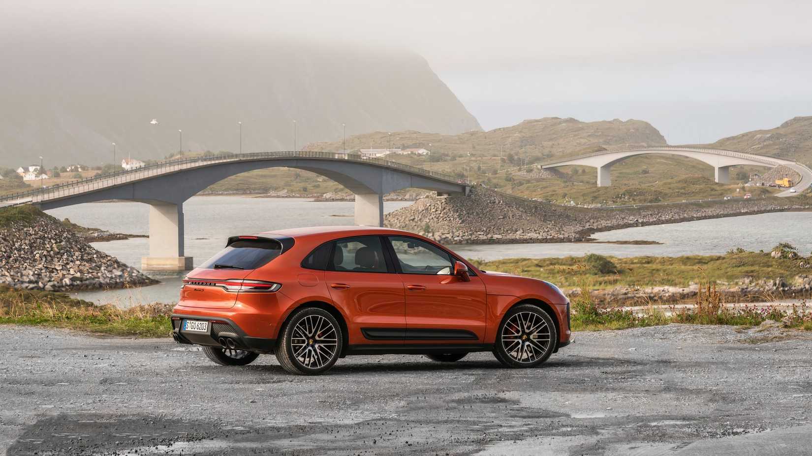 2024 Porsche Macan papaya orange rear 3/4 shot
