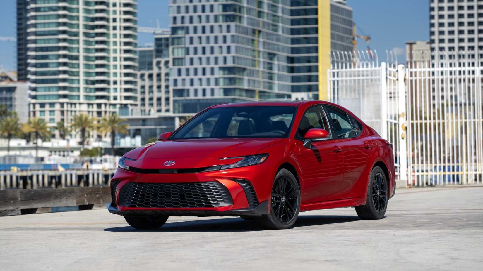 Red Toyota Camry front-quarter