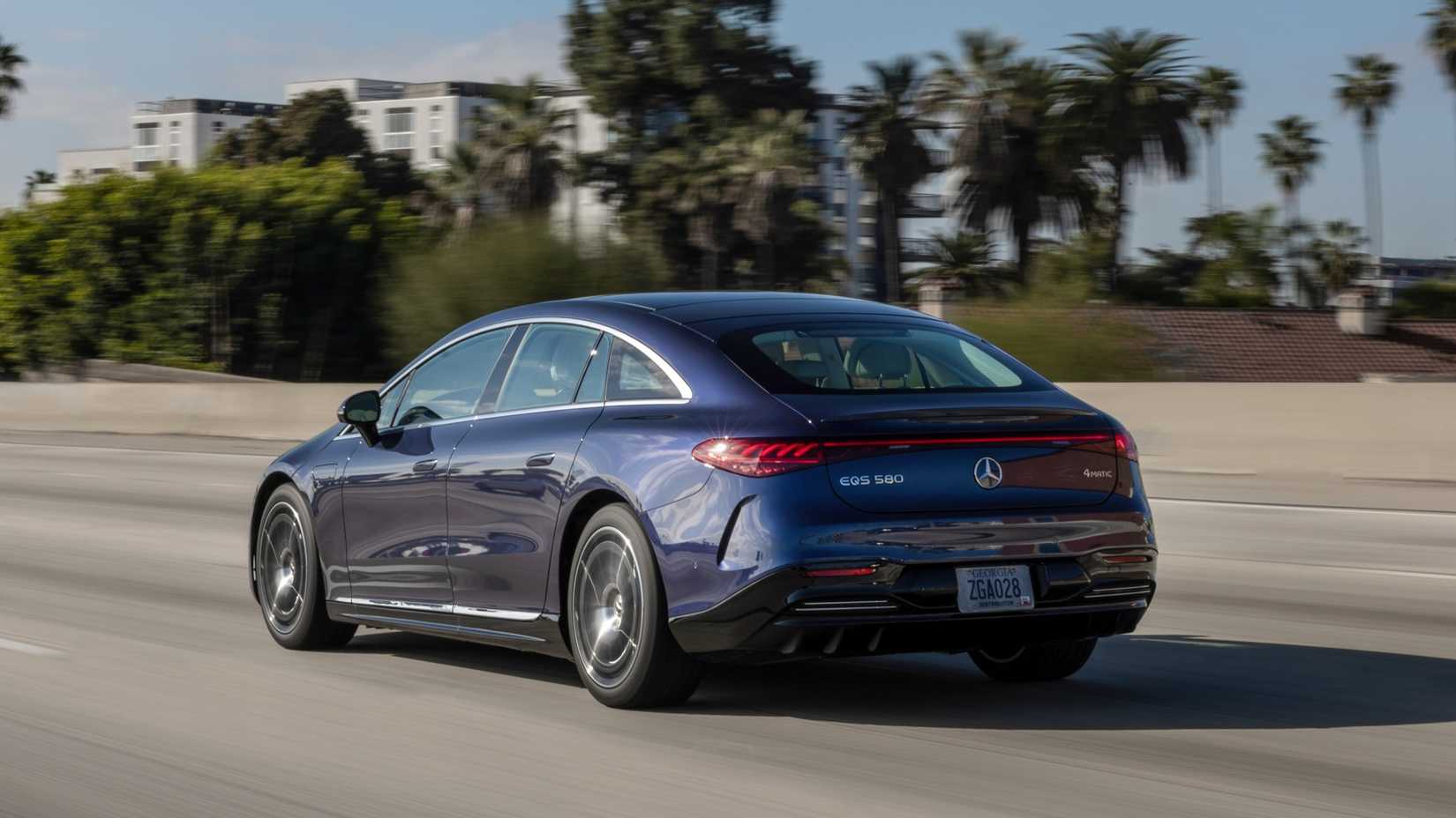 Blue Mercedes EQS Rear Three Quarter Shot driving on highway