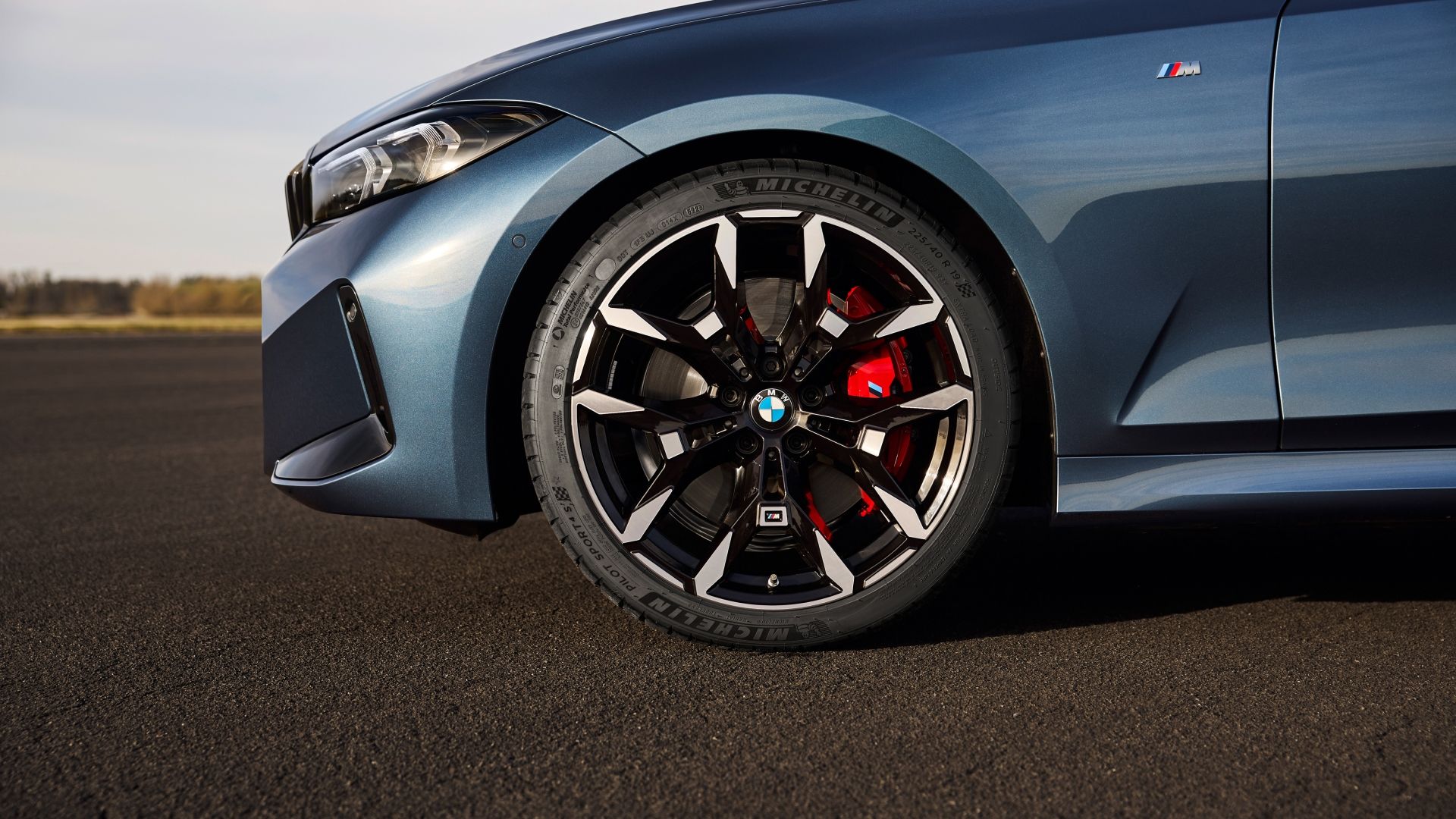 Close-up tire shot of a blue 2025 BMW 3 Series