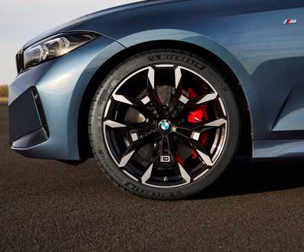Close-up tire shot of a blue 2025 BMW 3 Series