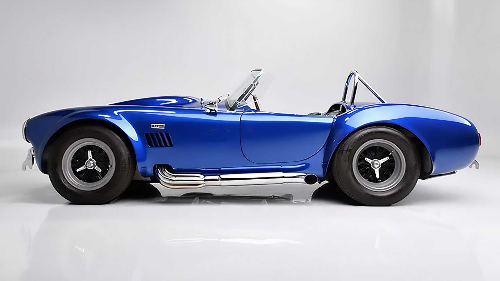 Blue 1966 AC Shelby Cobra 427 Super Snake side shot parked in the studio