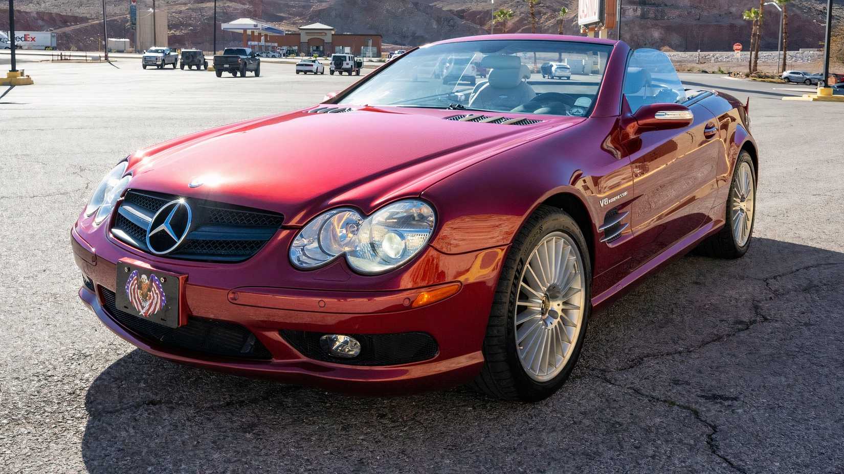 2004 mercedes-benz sl55 amg front 3/4 exterior shot with the top down.