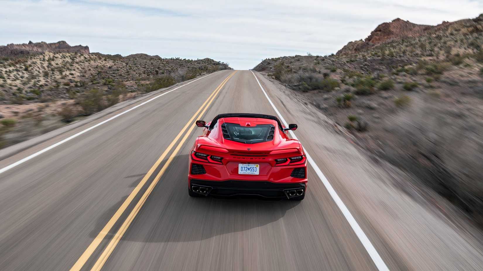 2020 Chevrolet Corvette Stingray red driving on a two lane highway