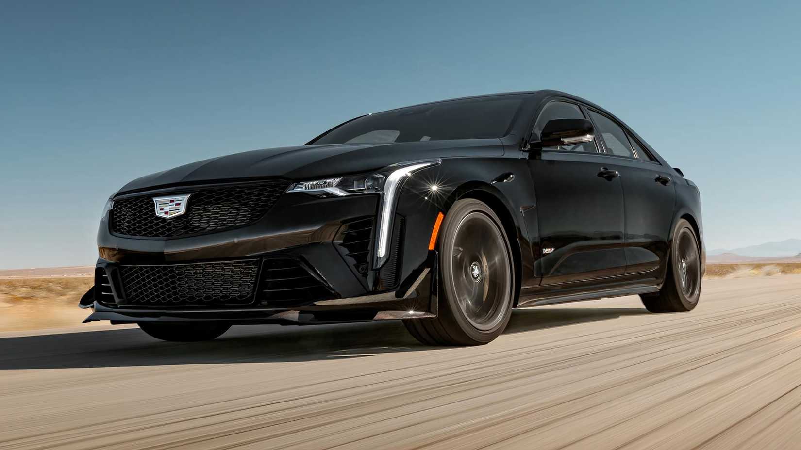 Front shot of a black 2023 Cadillac CT4-V Blackwing driving