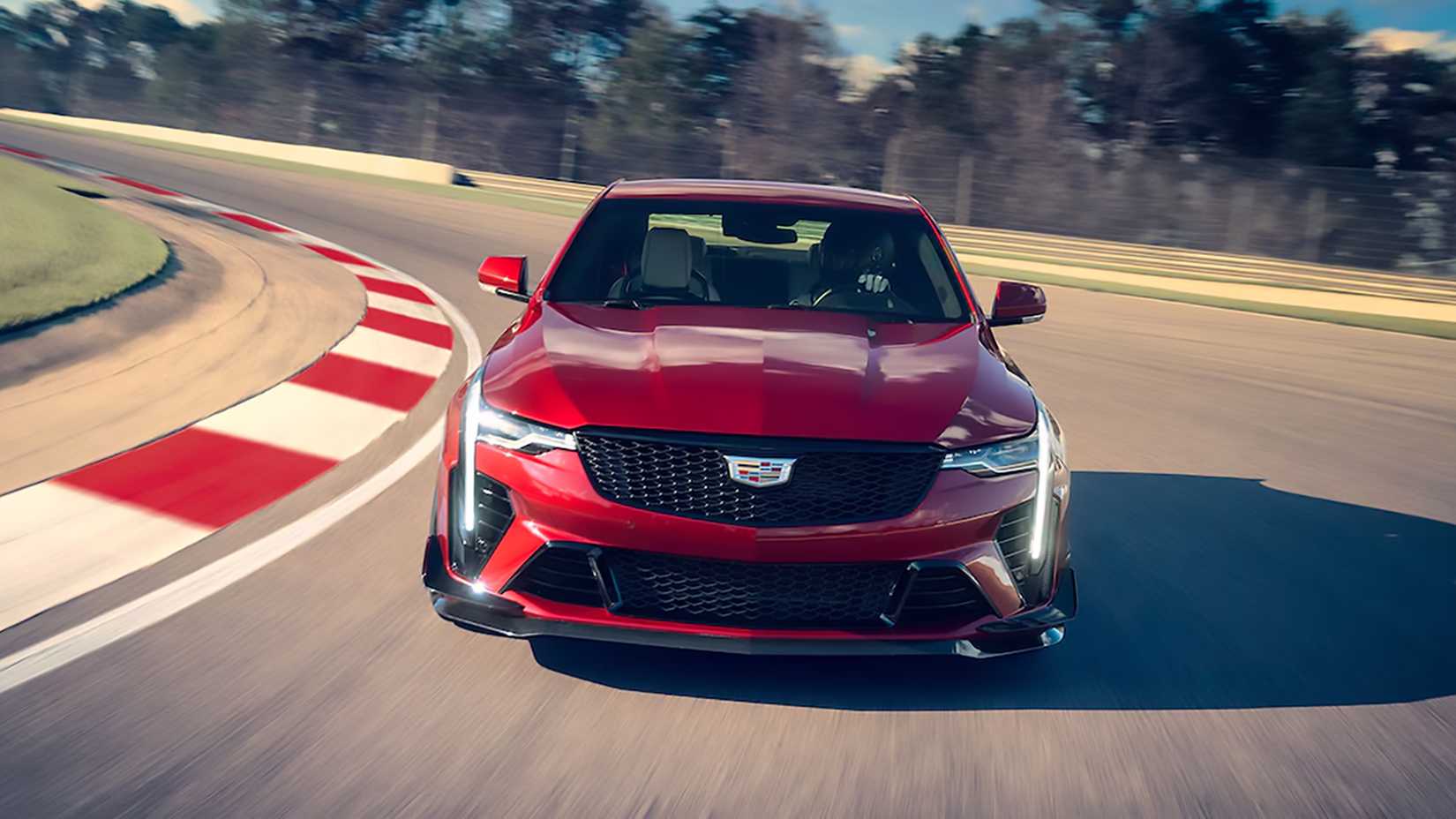Front shot of a Red 2024 Cadillac CT4-V Blackwing driving on track