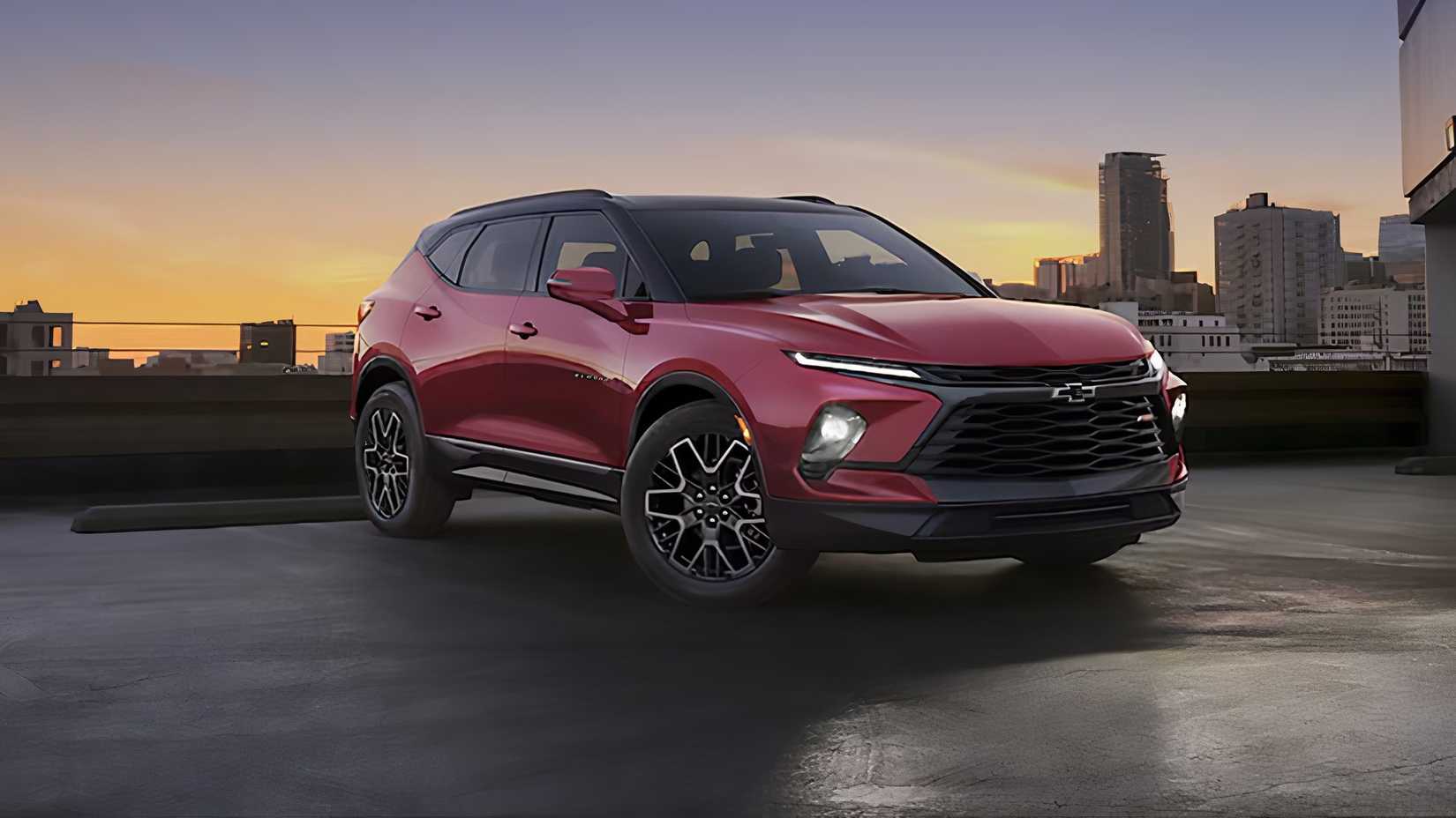 2025 Chevrolet Blazer in red parked in front of city scene