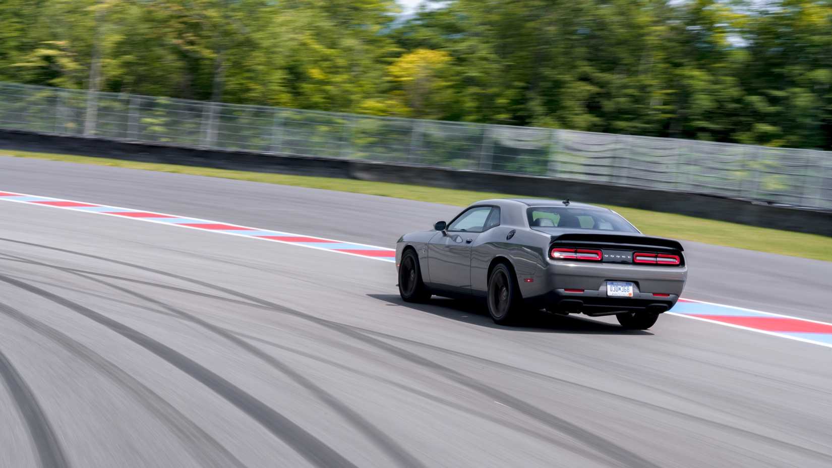 Rear 3/4 action shot of a 2019 Dodge Challenger SRT Hellcat