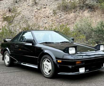 1986 Toyota MR2 in black Posing in parking lot