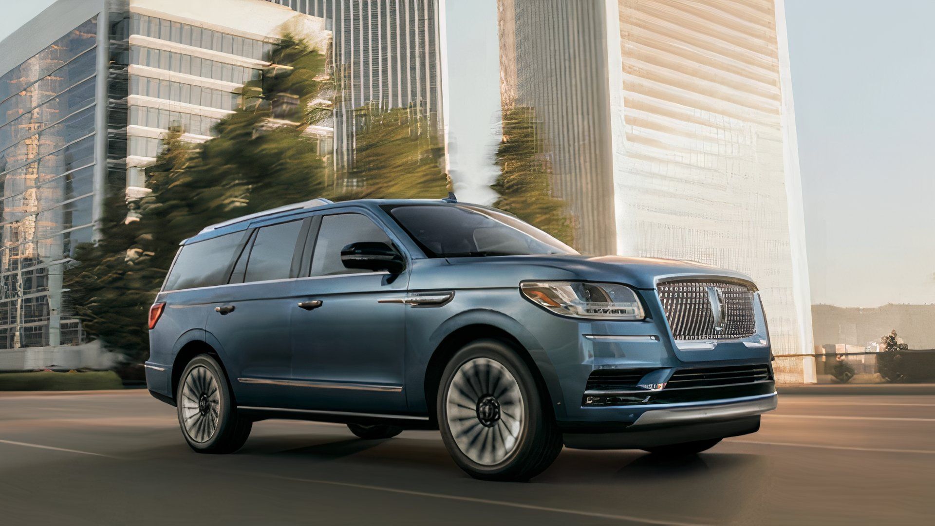 2019 Lincoln Navigator in blue driving through city