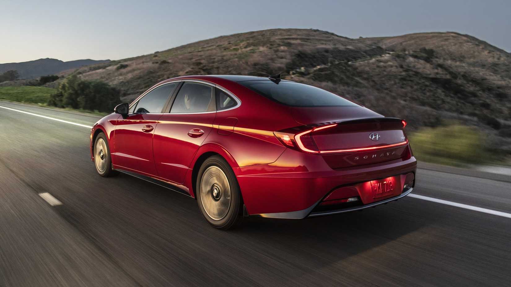 red 2023 Hyundai Sonata Hybrid Rear Driving