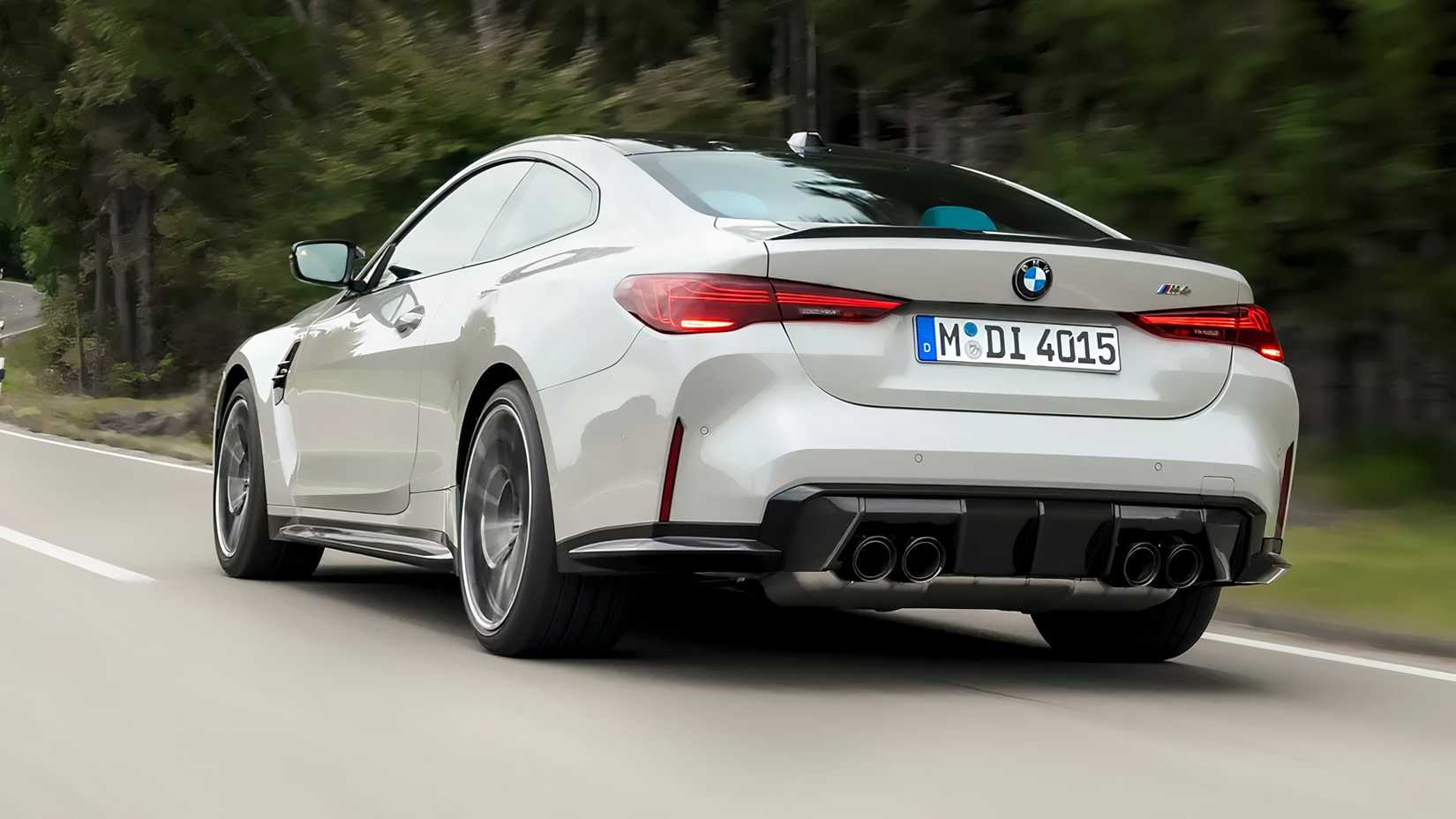 A Gray 2025 BMW M4 Competition Driving