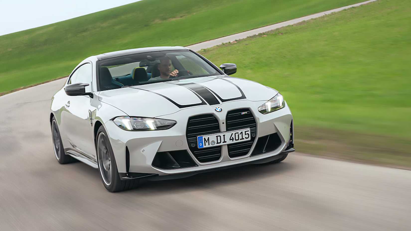 A Gray 2025 BMW M4 Competition Driving
