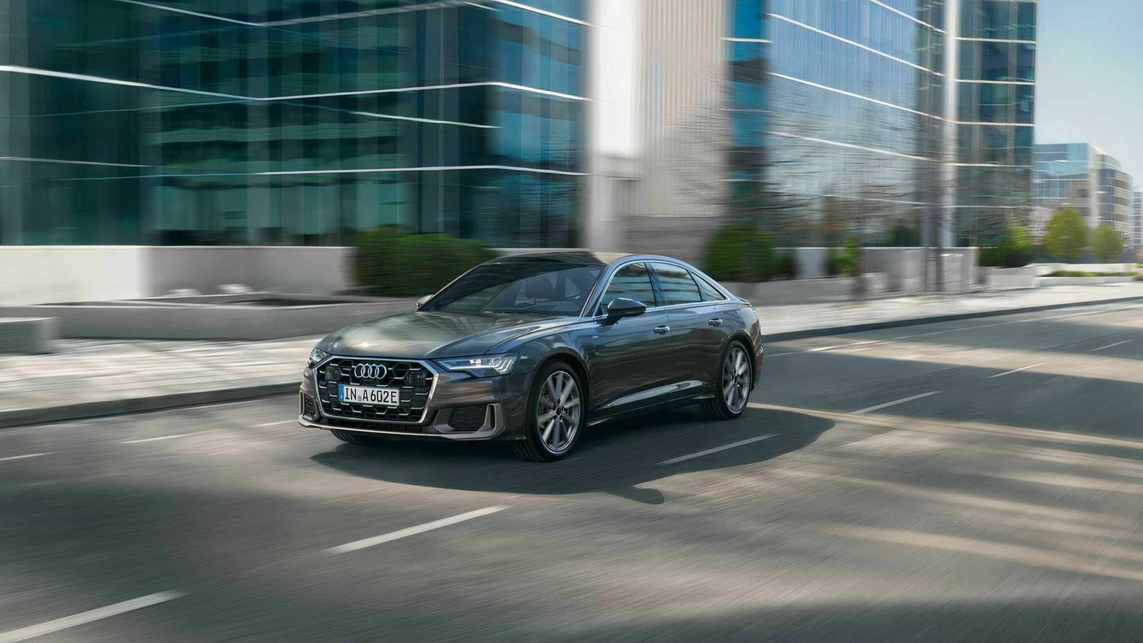 2023 Audi A6 in gray driving through city