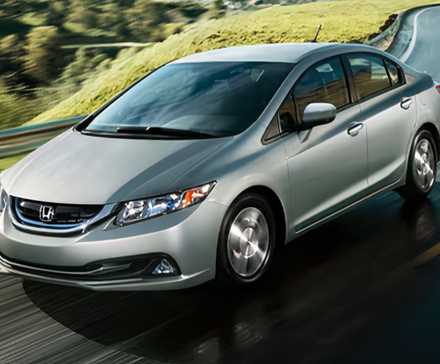 2009 Honda Civic Hybrid Sedan in silver Driving on country road