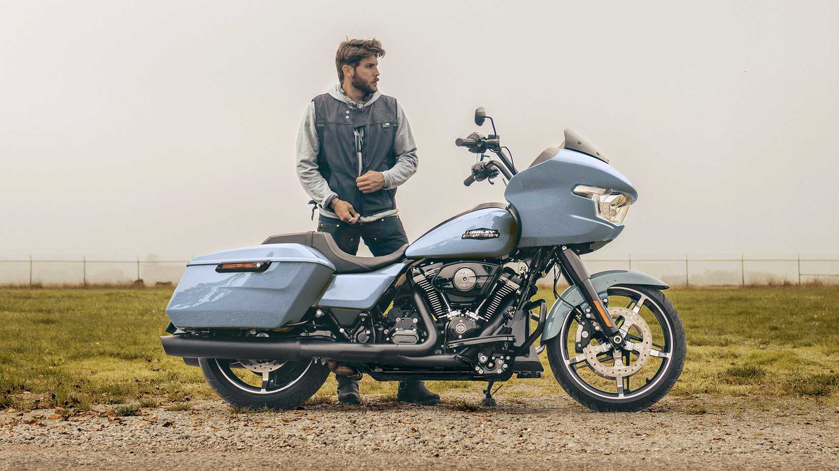 Rider standing next to a 2024 Harley-Davidson Road Glide