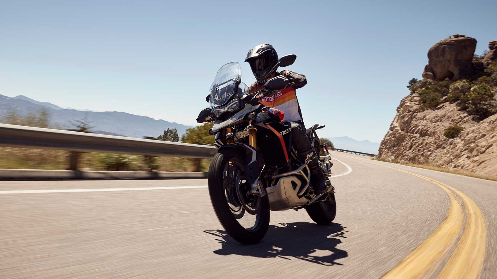 Triumph Tiger 900 Rally Pro accelerating on the road
