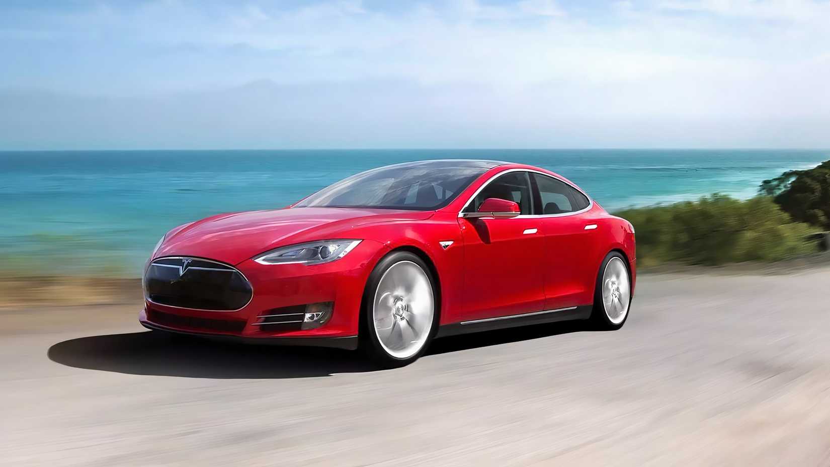 A Red 2012 Tesla Model S Driving