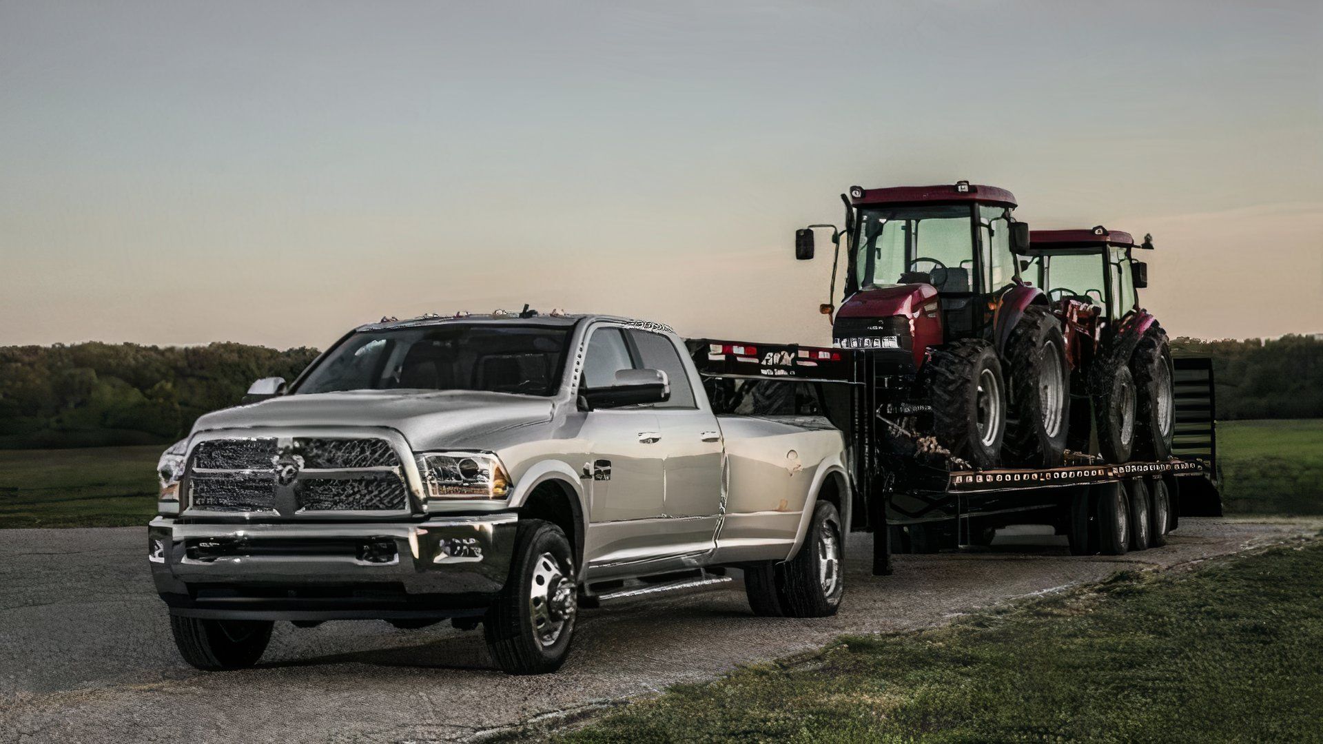Front 3/4 shot of a 2015 Ram 2500 hauling tractors