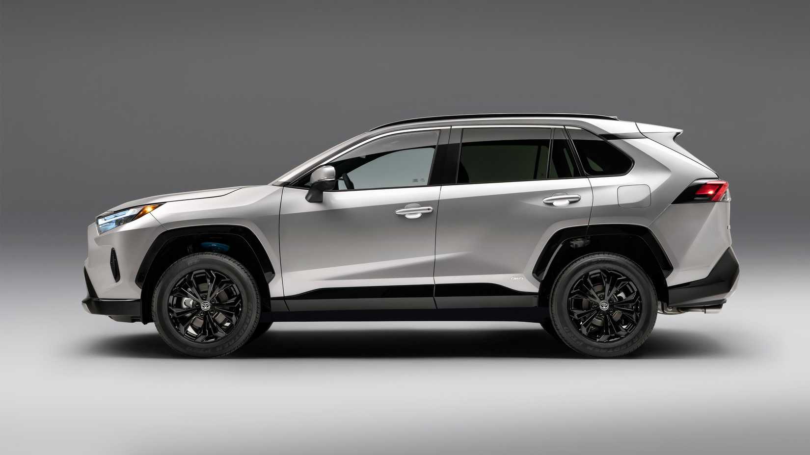 Side profile shot of a silver 2022 Toyota RAV4 SE Hybrid