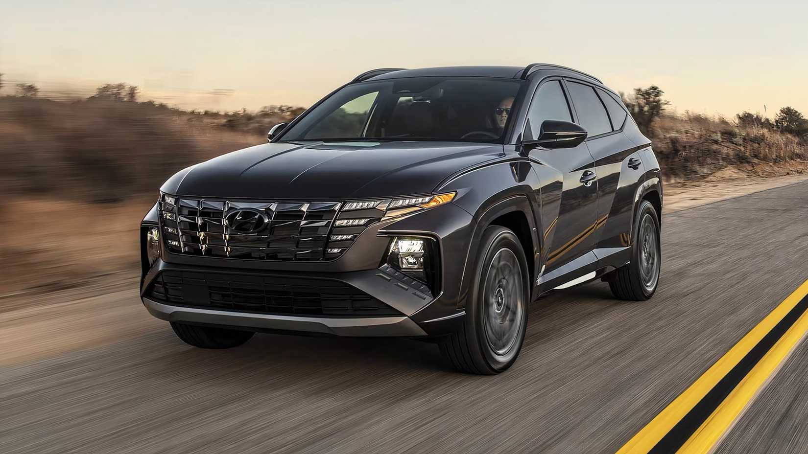 2023 Hyundai Tucson in black driving along desert highway