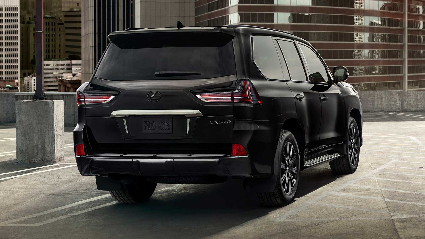 A perspective studio shot of the rear, right hand-side of a 2021 Lexus LX 570
