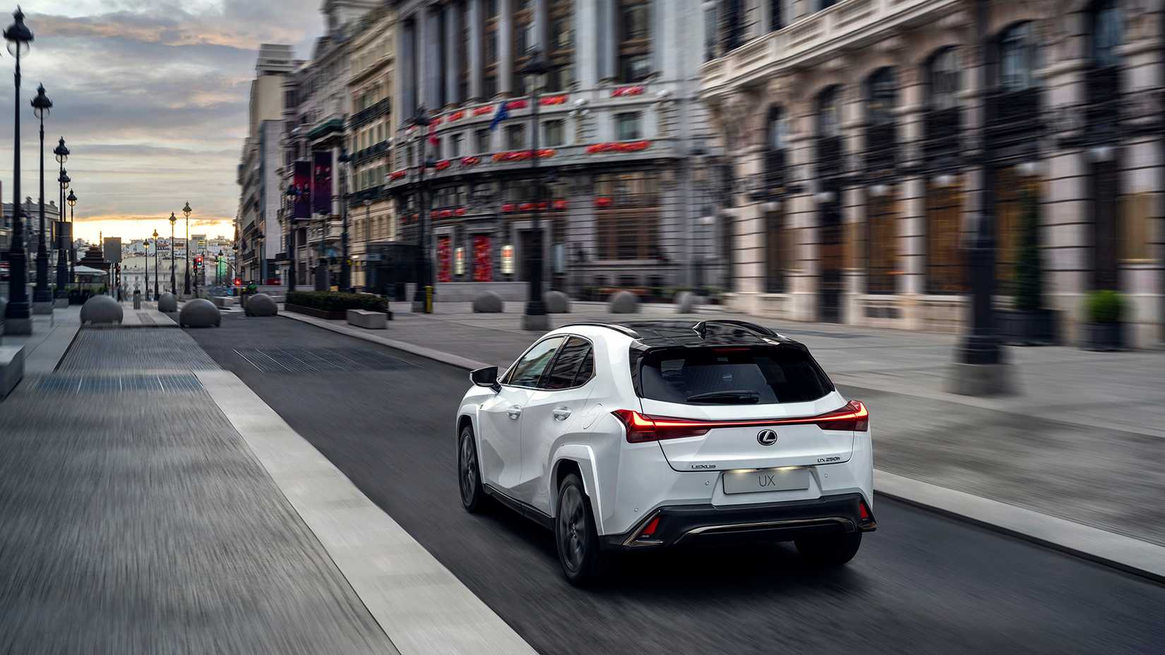 2023 Lexus UXh F Sport rear 3/4 action shot