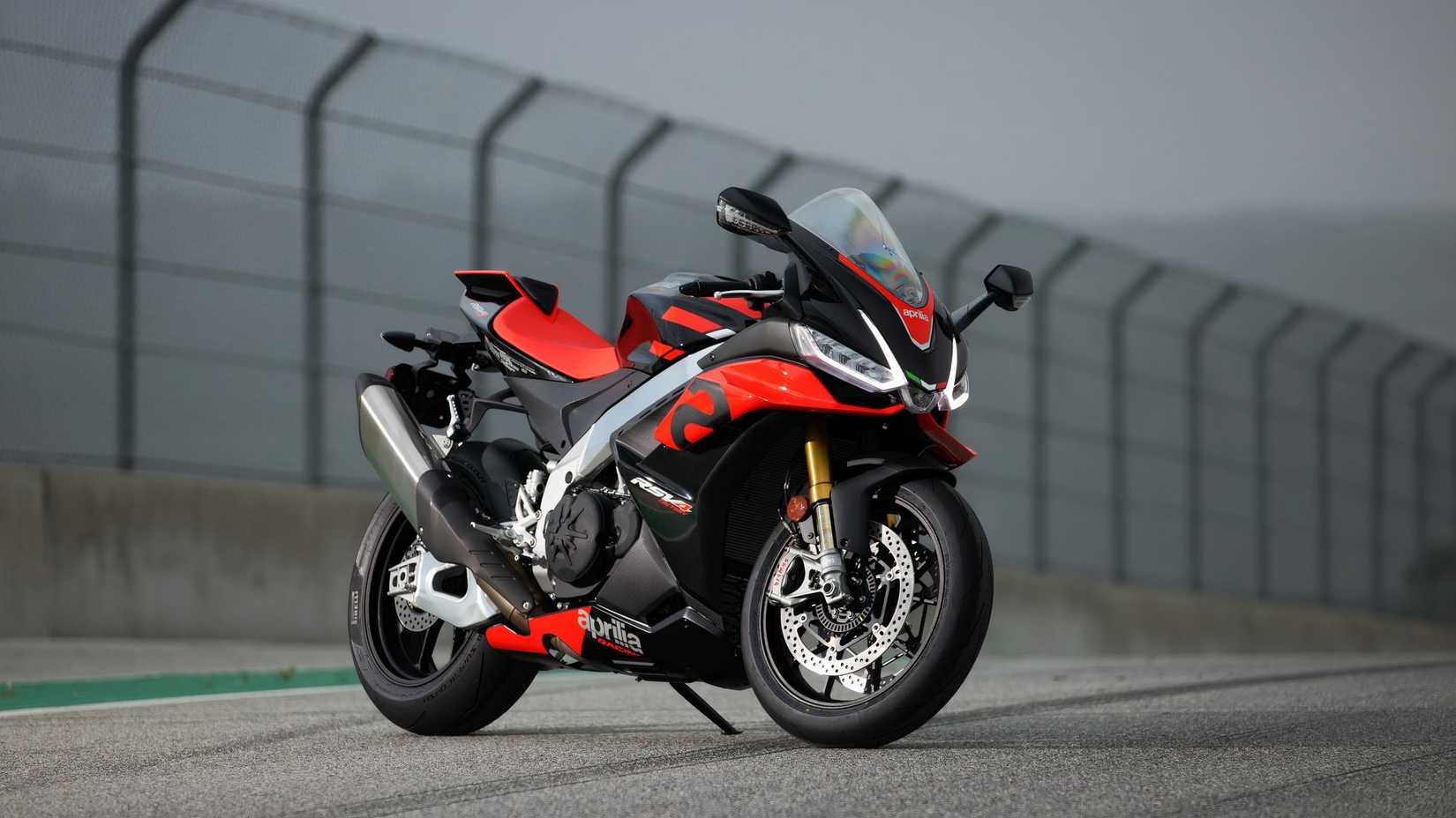 A 2025 Aprilia RSV4 Factory Full parked on a racetrack