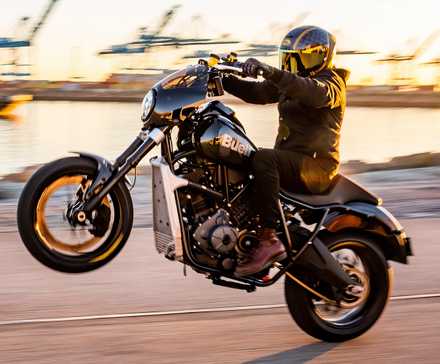 2025 Buell Super Cruiser popping wheelie hd American power cruiser wallpaper