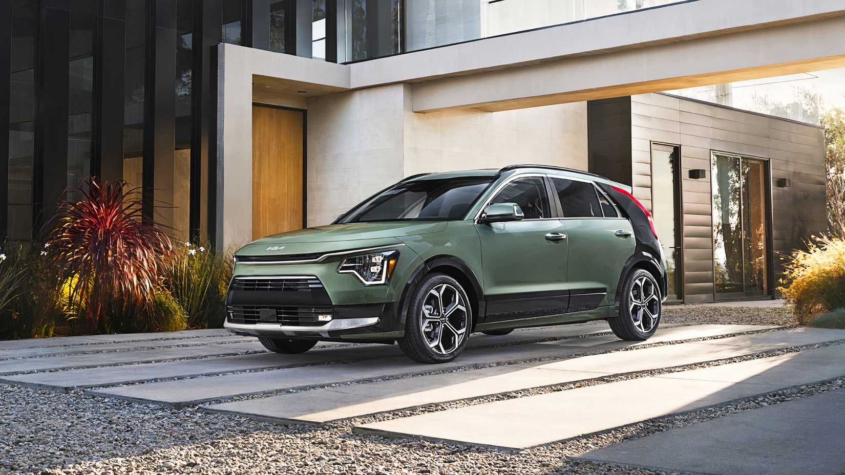 A green Kia Niro hybrid subcompact SUV. 