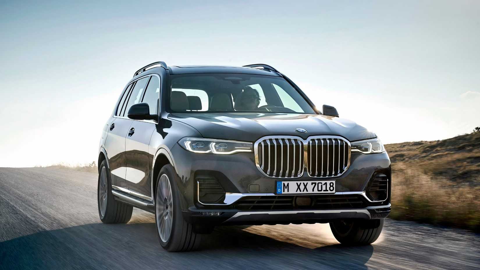 2019 BMW X7 in black driving on road
