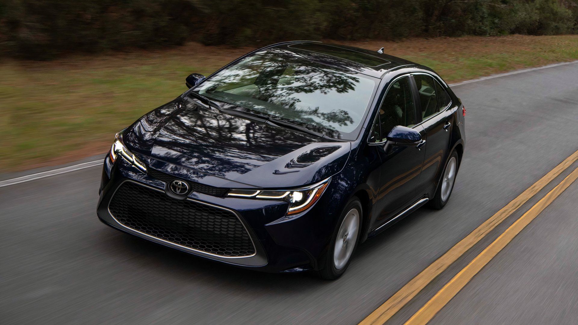 2019 Toyota Corolla in black driving on country road