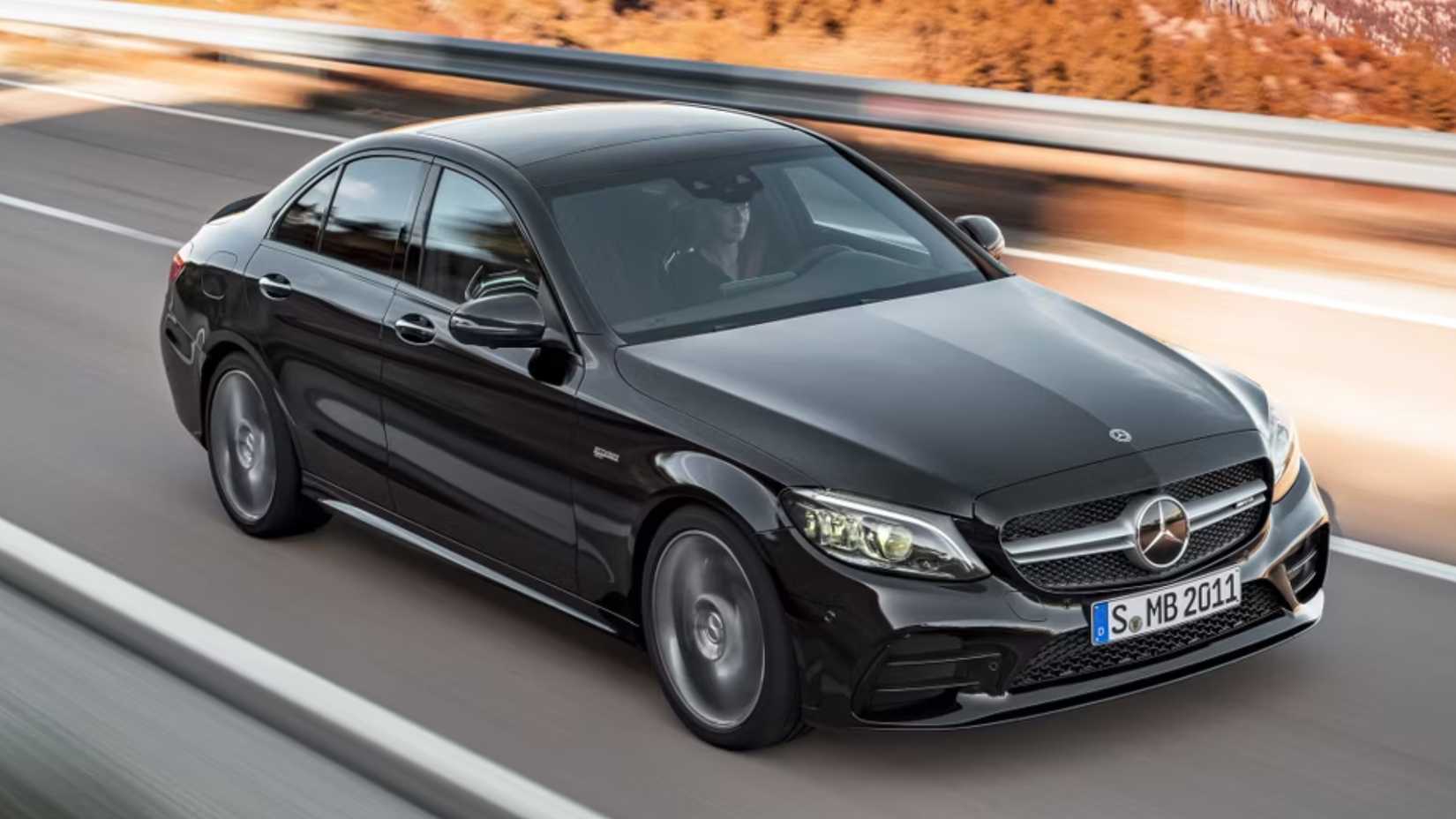 Black 2021 Mercedes-AMG C43 front driving shot