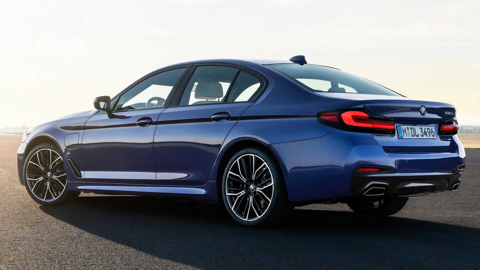 2023 BMW 5 Series parked on a road
