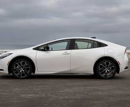 Side profile shot of a 2023 Toyota Prius Limited in Wind Chill Pearl exterior shade
