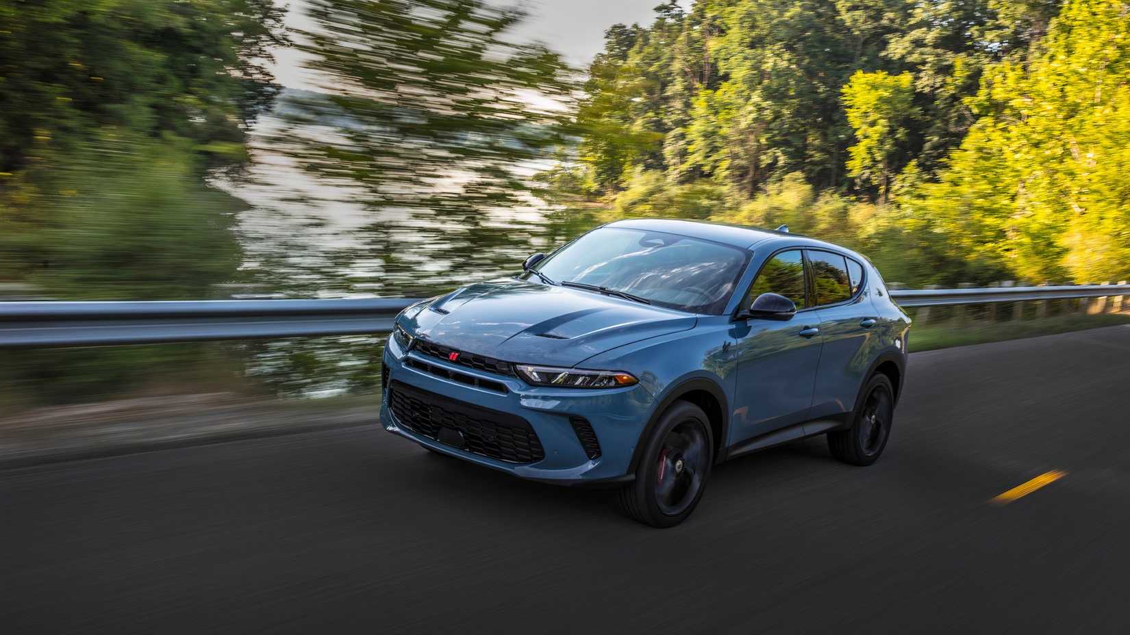 2024 Dodge Hornet in blue driving on a street