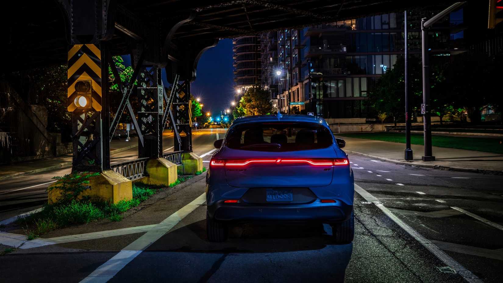 A 2024 Dodge Hornet GT from the back at night