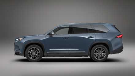 Side profile studio shot of the 2024 Toyota Grand Highlander Hybrid finished in Storm Cloud exterior shade