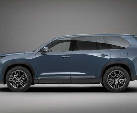 Side profile studio shot of the 2024 Toyota Grand Highlander Hybrid finished in Storm Cloud exterior shade