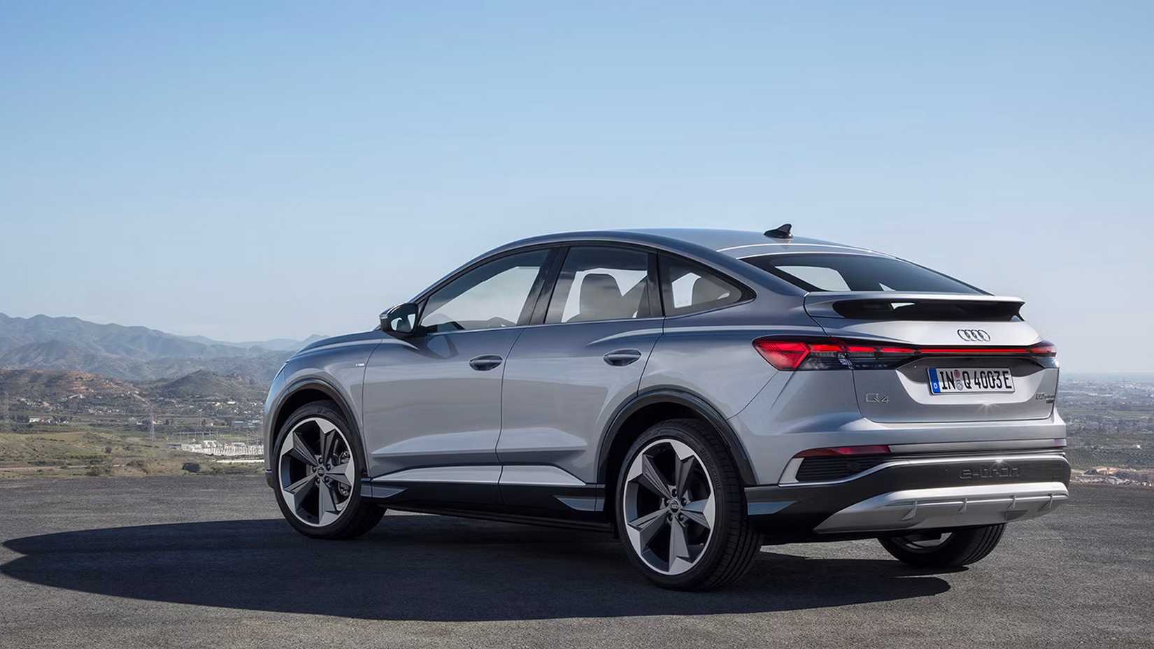 A rear, left hand-side three-quarter shot of a 2023 Audi Q4 e-tron Sportback