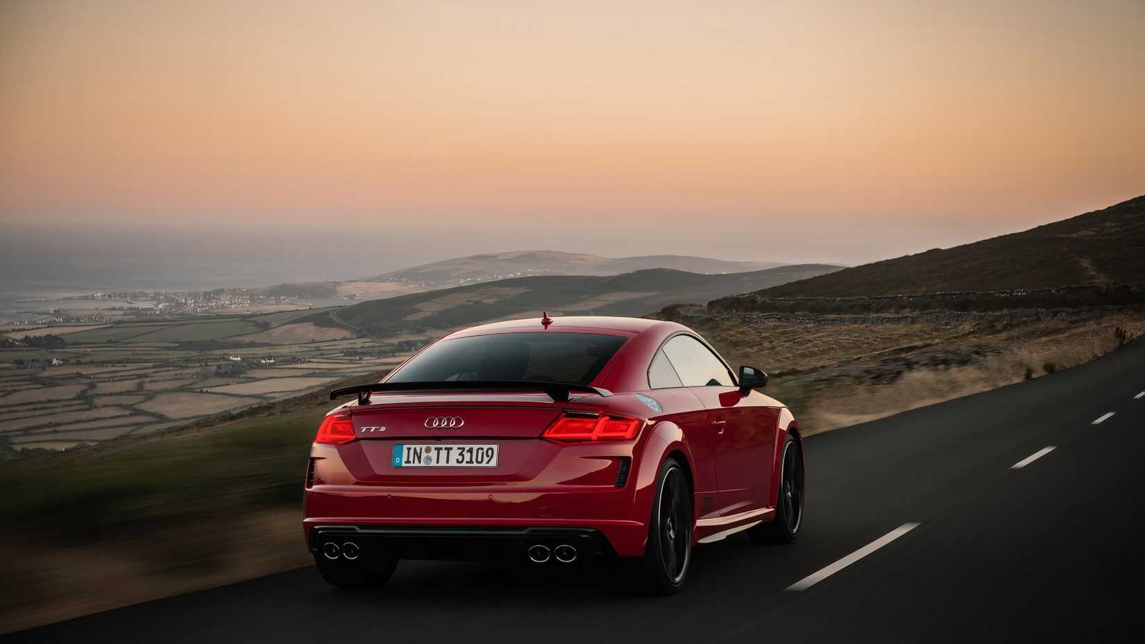 An action shot of the 2023 Audi TTS on a mountain road