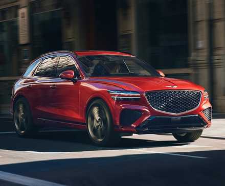 2023 Genesis GV70 em vermelho dirigindo nas ruas da cidade