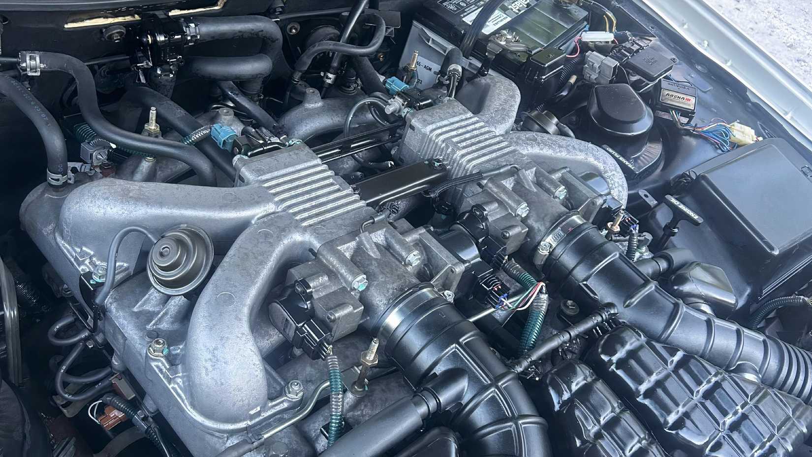 1997 Toyota Century G50 engine bay showing V-12 engine without engine cover