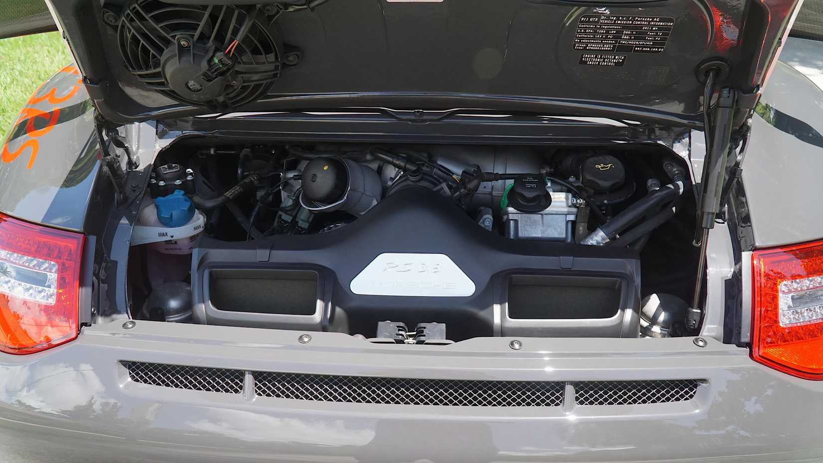 2011 Porsche 997 GT3 RS in gray engine bay showing Mezger flat-six