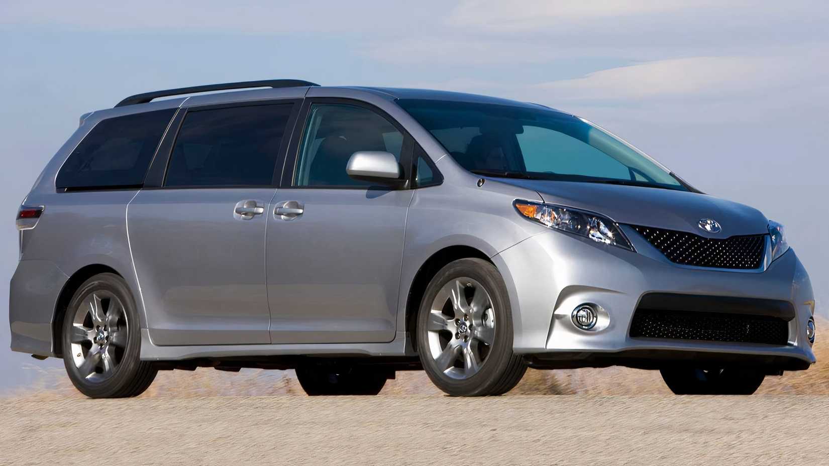 2013 Toyota Sienna in silver posing in desert