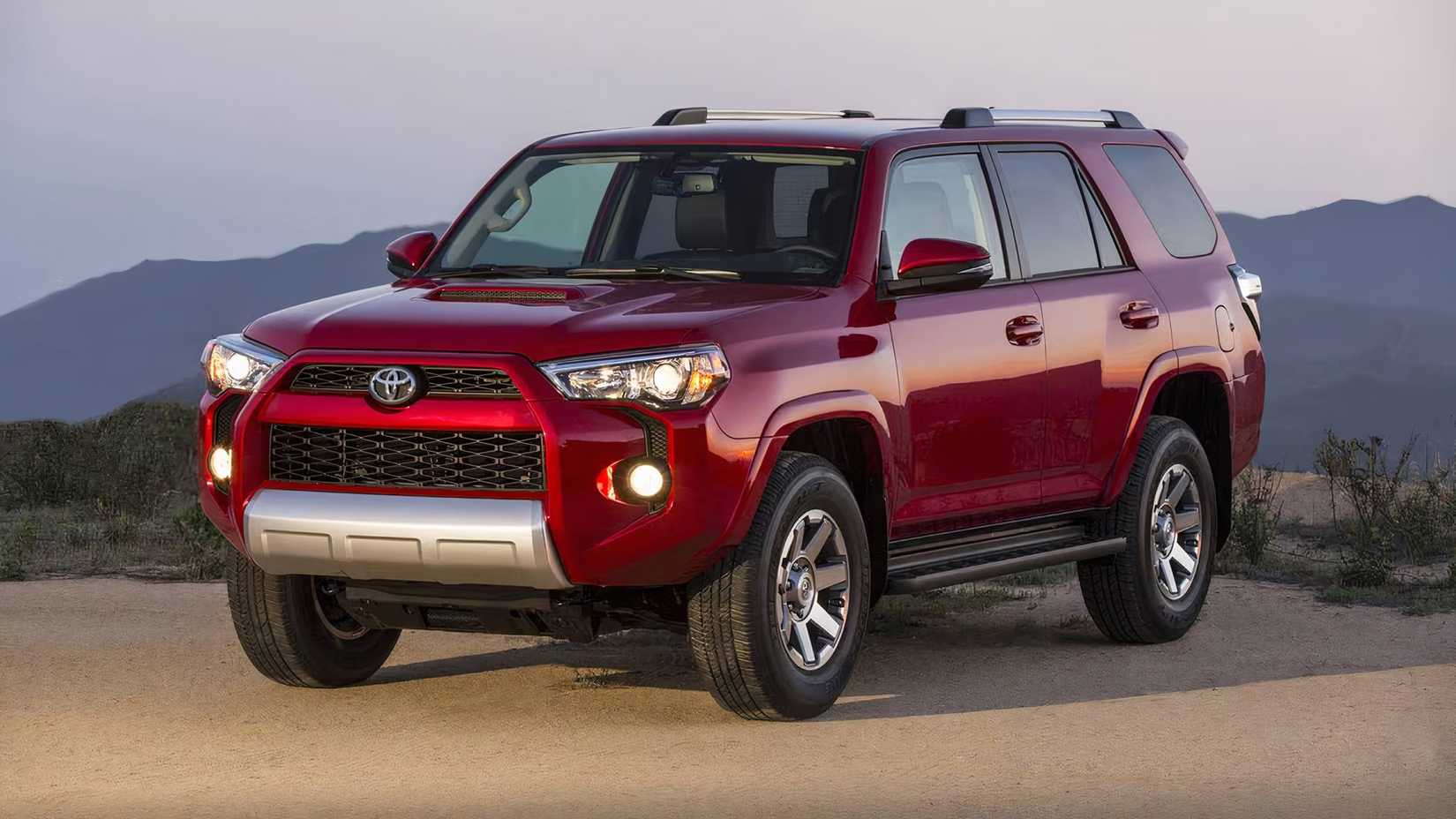2017 Toyota 4Runner in red posing in front of mountain range