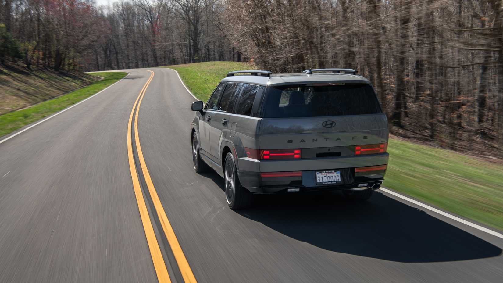 Rear 3/4 action shot of a 2025 Hyundai Santa Fe 