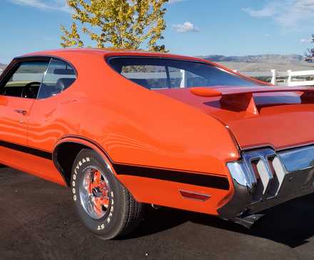 3/4 rear view of 1970 Oldsmobile 442 Orange