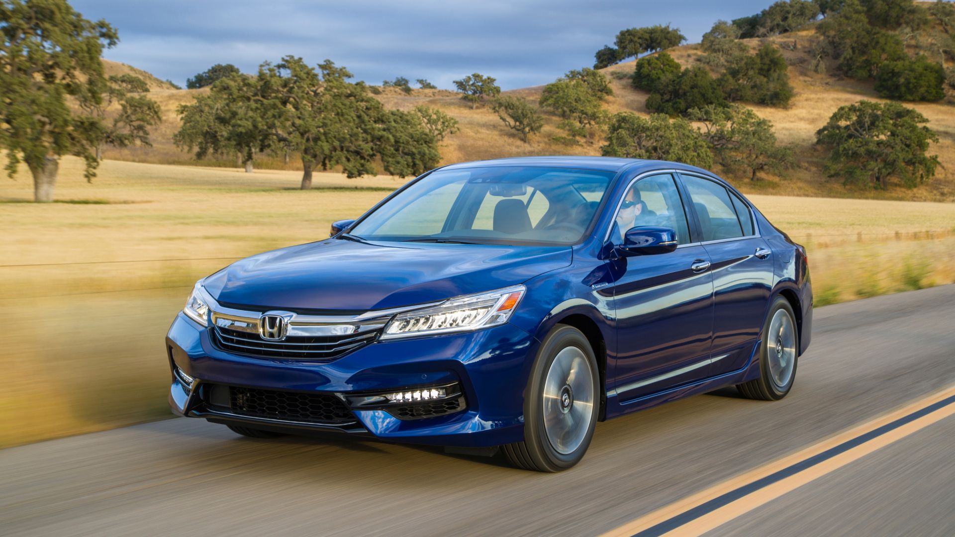 Three-quarter front view of a 2017 blue Honda Accord hybrid